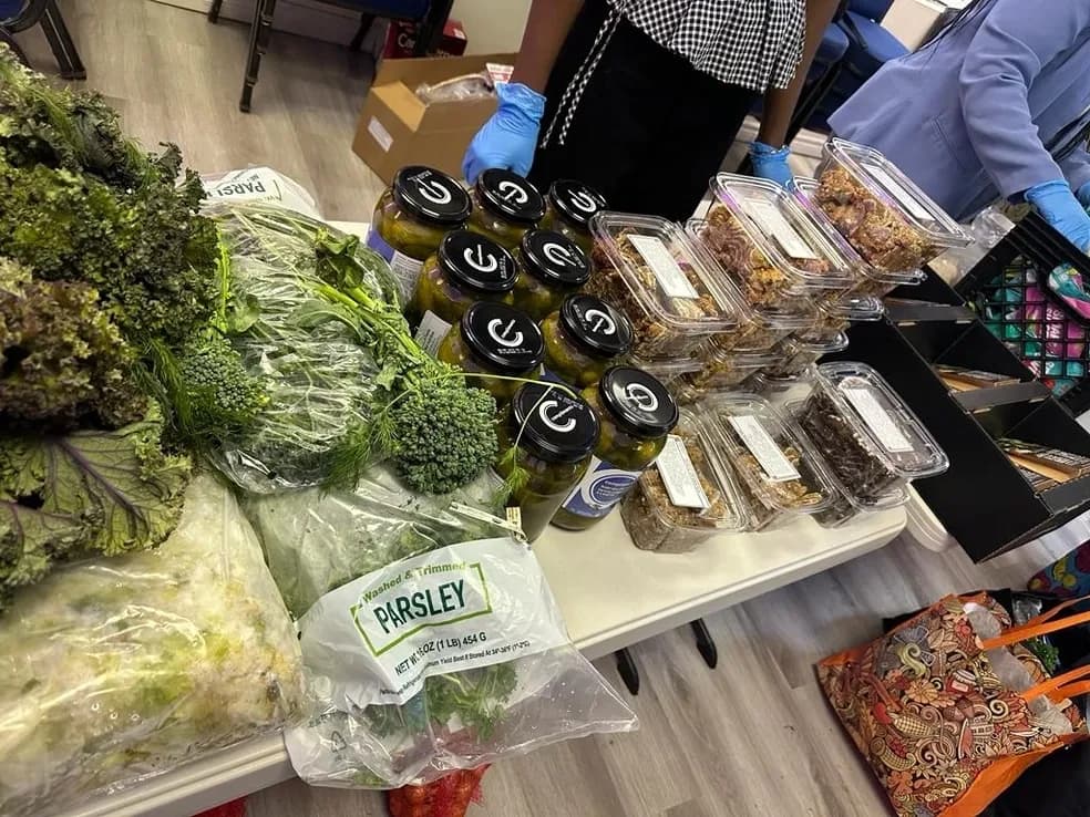 Volunteers packing grocery bags for the weekly walk-in food bank